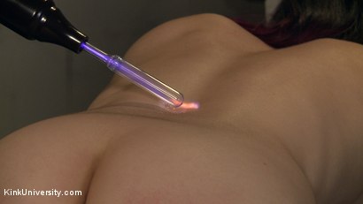 Kinky lesbian dominatrix uses electro wand