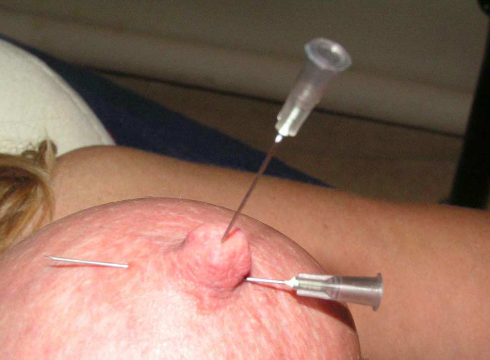 Sadistic female dentists injecting needle