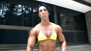 Strong woman flexes biceps