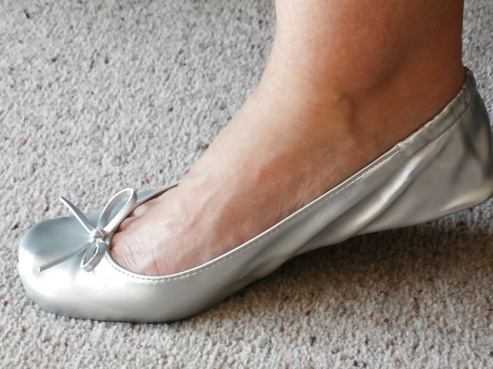 Shoeplay under desk silver ballet flats